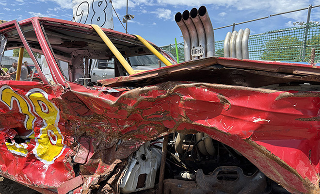 red smashed up car with hood exhaust