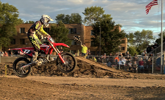 a Motokazie motocross racer gets air at the Carver County Fair grandstand