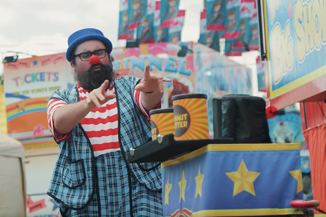 Lew-E the clown performs a magic trick