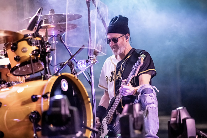 Gen X Jukebox bass player next to the drum set