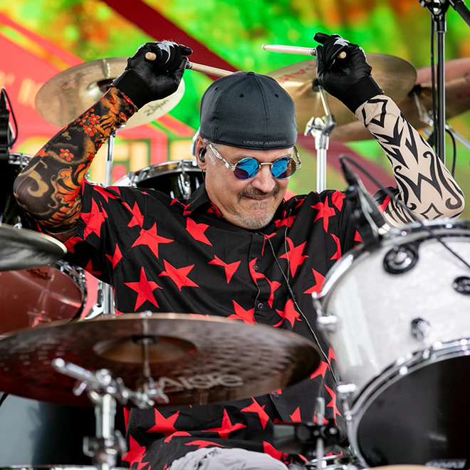 drummer of Muddcat Melby plays the drum set