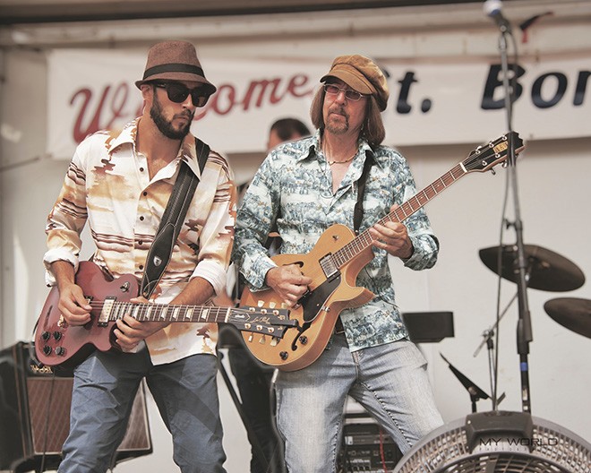 two guitarists from Sawyers Dream performing on stage